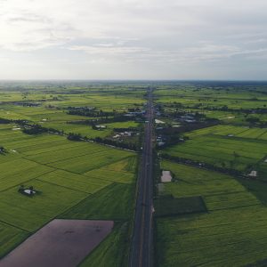 Aerial view over small village, Country roadside.