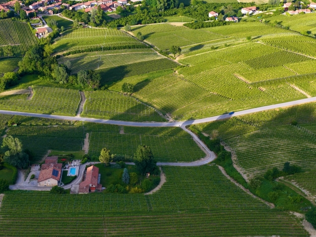 aerial-view-rolling-green-vineyards-countryside-village-italy
